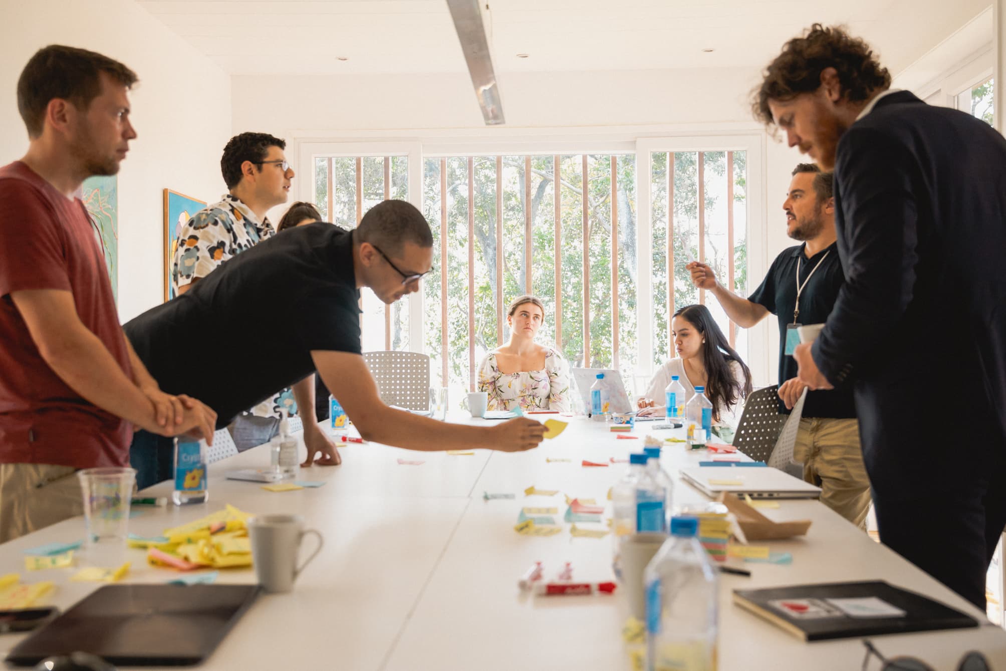 Group of people collaborating around a table.